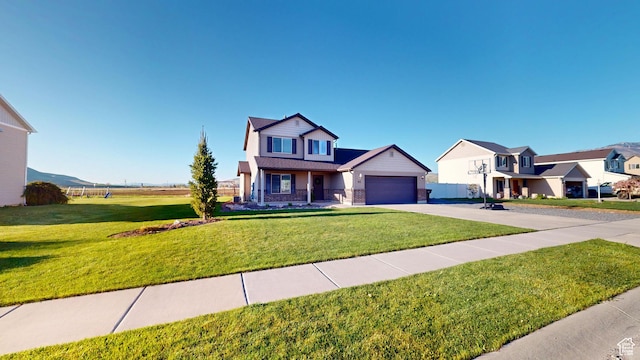 90 W Cedar Ln, Franklin, ID 83237 - view of front of house with concrete driveway, a front yard, brick siding, and a garage