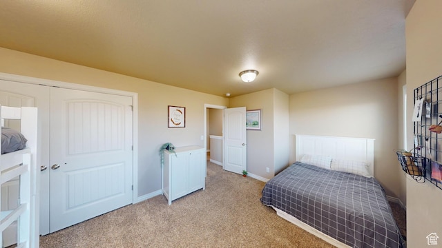 90 W Cedar Ln, Franklin, ID 83237 - bedroom featuring light carpet, baseboards, and a closet
