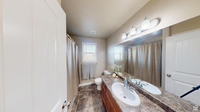 90 W Cedar Ln, Franklin, ID 83237 - bathroom featuring vanity, baseboards, toilet, stone finish flooring, and a shower with shower curtain