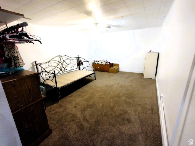 carpeted bedroom featuring baseboards