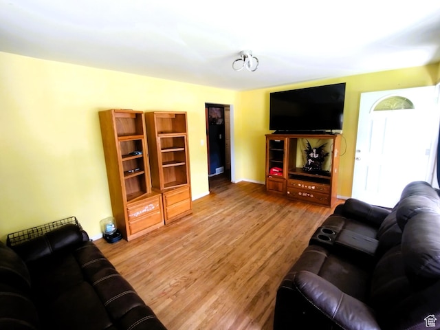 living room with wood finished floors and baseboards