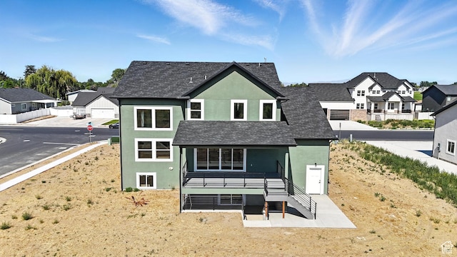 1734 N 4100 W, Plain City, UT 84404 - back of property featuring stucco siding and a residential view
