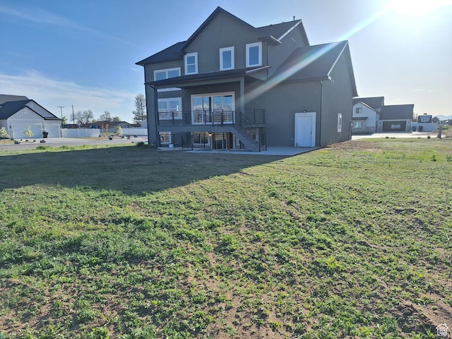 1734 N 4100 W, Plain City, UT 84404 - rear view of property featuring stairway, stucco siding, a lawn, and a patio area