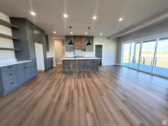 1734 N 4100 W, Plain City, UT 84404 - kitchen featuring baseboards, open shelves, recessed lighting, light wood-style flooring, and a sink