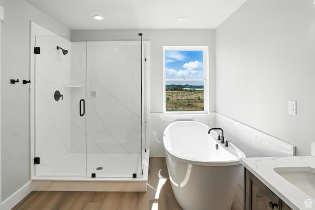 1734 N 4100 W, Plain City, UT 84404 - full bath with wood finished floors, a freestanding bath, a marble finish shower, vanity, and recessed lighting