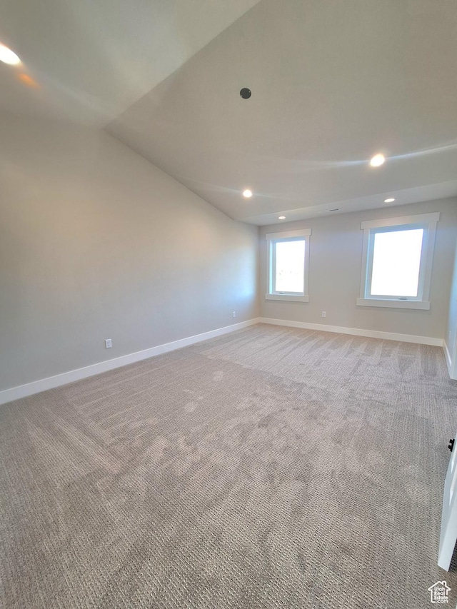 1734 N 4100 W, Plain City, UT 84404 - spare room featuring baseboards, light carpet, recessed lighting, and lofted ceiling