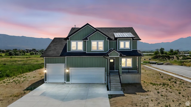 1734 N 4100 W, Plain City, UT 84404 - view of front of property featuring a mountain view, driveway, and an attached garage