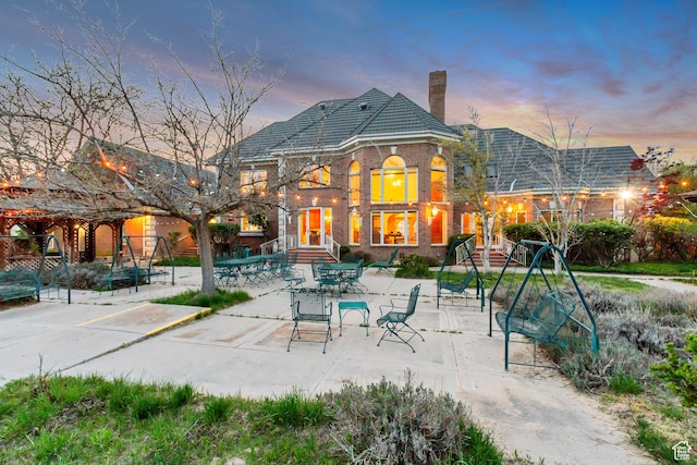 542 E 10000 S, Salem, UT 84653 - back of house featuring a chimney, brick siding, a patio area, and a tile roof