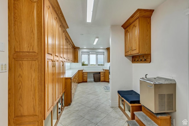 542 E 10000 S, Salem, UT 84653 - kitchen featuring light tile patterned flooring, brown cabinetry, light countertops, and dishwasher