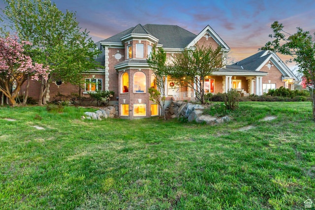 542 E 10000 S, Salem, UT 84653 - back of house with brick siding, a lawn, and covered porch