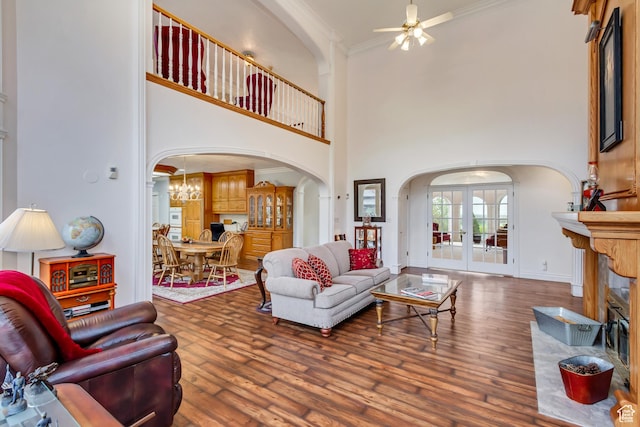 542 E 10000 S, Salem, UT 84653 - living area with arched walkways, ceiling fan, wood finished floors, crown molding, and a towering ceiling