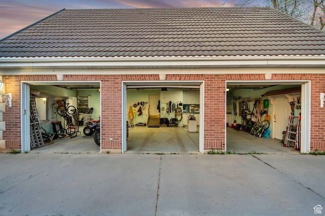 542 E 10000 S, Salem, UT 84653 - garage at dusk with concrete driveway