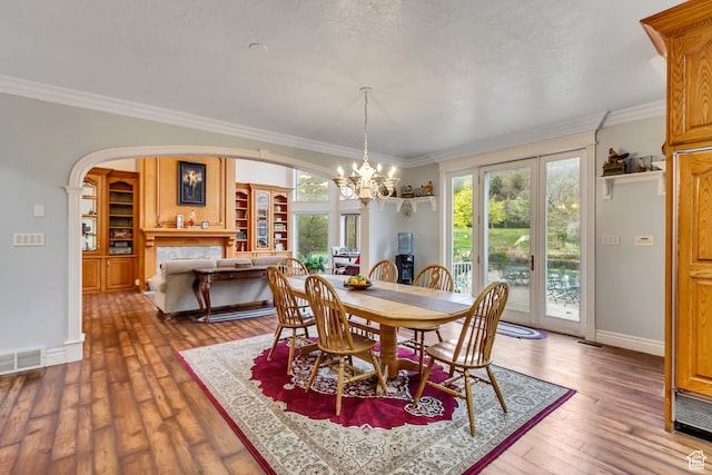 542 E 10000 S, Salem, UT 84653 - dining space featuring a chandelier, ornamental molding, arched walkways, wood-type flooring, and baseboards