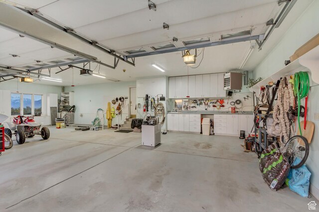 542 E 10000 S, Salem, UT 84653 - garage featuring a garage door opener