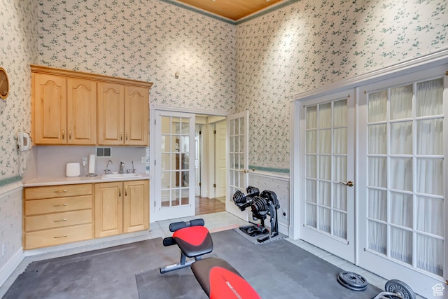 542 E 10000 S, Salem, UT 84653 - exercise area featuring wallpapered walls, french doors, a sink, and wainscoting