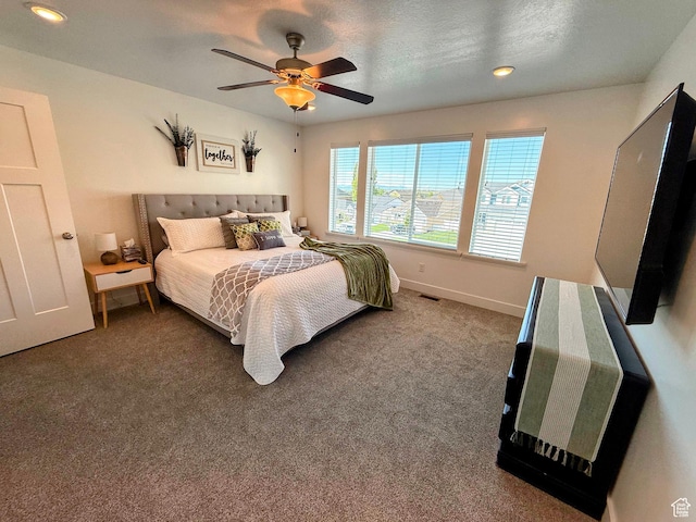 carpeted bedroom featuring baseboards, recessed lighting, and a ceiling fan