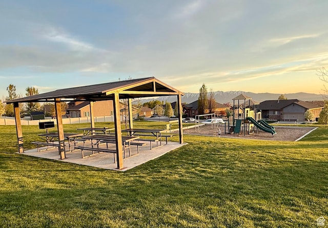 community play area with a gazebo and a yard