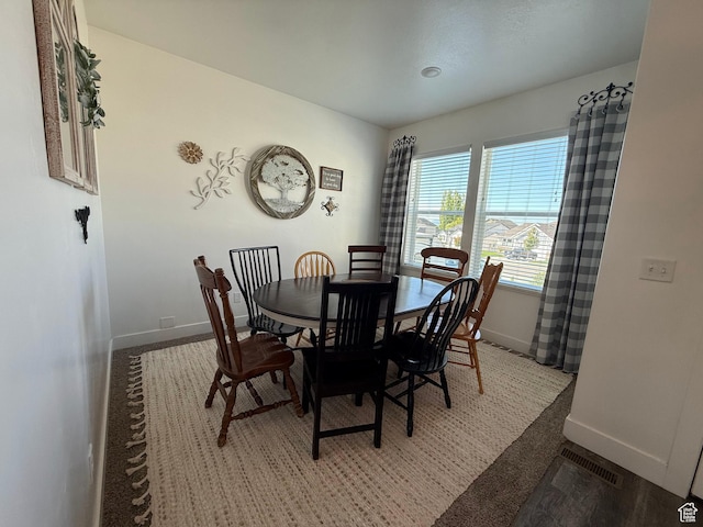dining room featuring baseboards