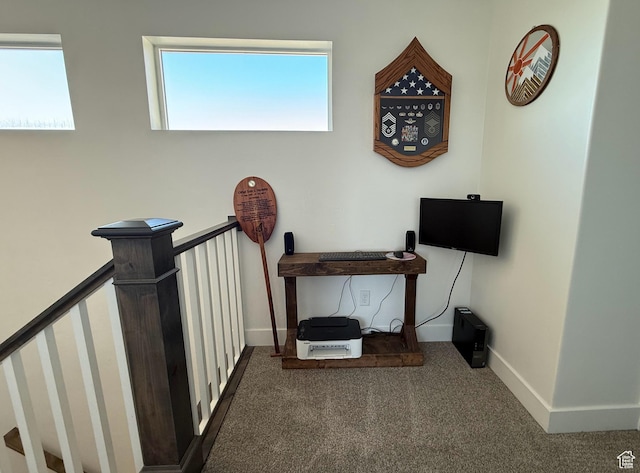 stairway featuring carpet and baseboards