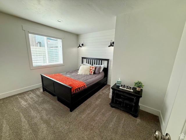 carpeted bedroom with baseboards