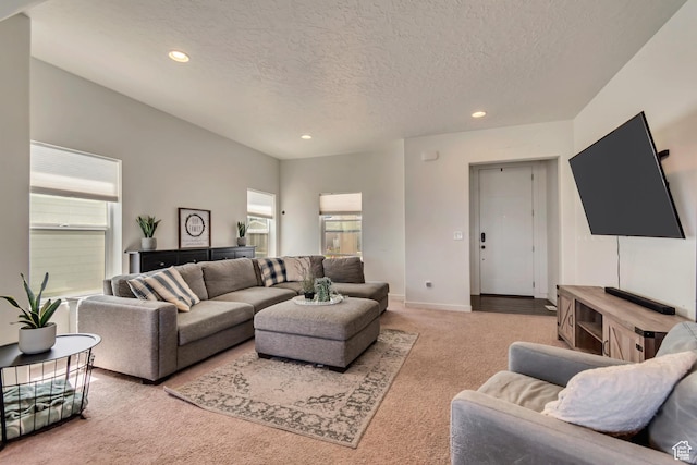 living room with carpet, recessed lighting, a textured ceiling, and baseboards