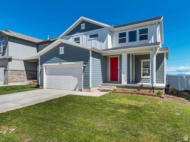 view of front of home with board and batten siding, concrete driveway, a front yard, an attached garage, and a porch