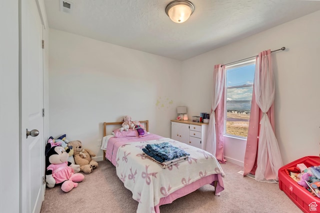 bedroom featuring light colored carpet and baseboards