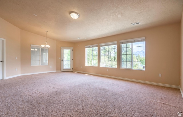 1195 W Dallin Dr N Unit R301, Pleasant Grove, UT 84062 - unfurnished room with a chandelier, baseboards, carpet floors, a textured ceiling, and vaulted ceiling