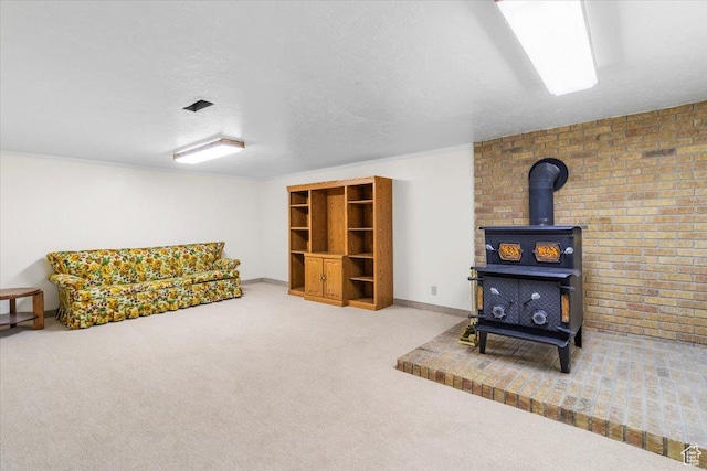 377 N 300 E, Nephi, UT 84648 - living area featuring a wood stove, carpet flooring, baseboards, and a textured ceiling