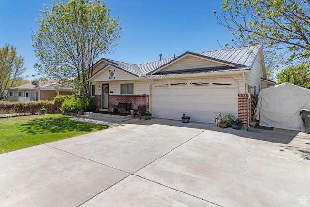 377 N 300 E, Nephi, UT 84648 - view of front of house with brick siding, a garage, driveway, a standing seam roof, and a front lawn