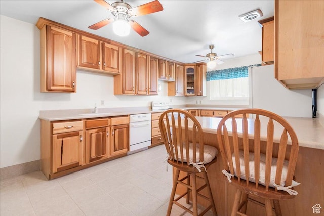 377 N 300 E, Nephi, UT 84648 - kitchen with white dishwasher, a sink, a ceiling fan, and light countertops