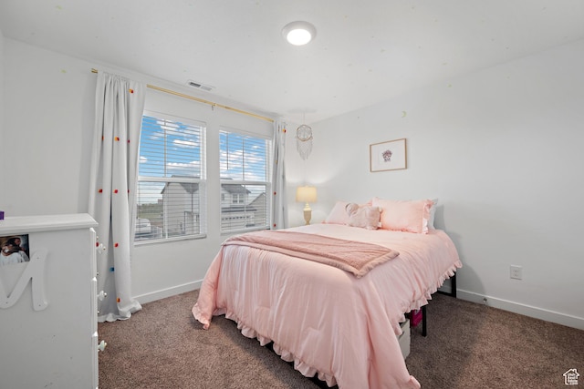 carpeted bedroom featuring baseboards