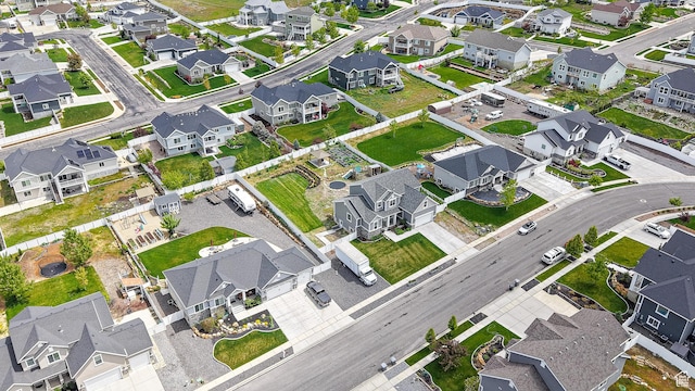aerial view of property and surrounding area featuring nearby suburban area