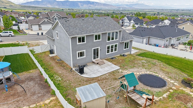 aerial perspective of suburban area with a mountainous background