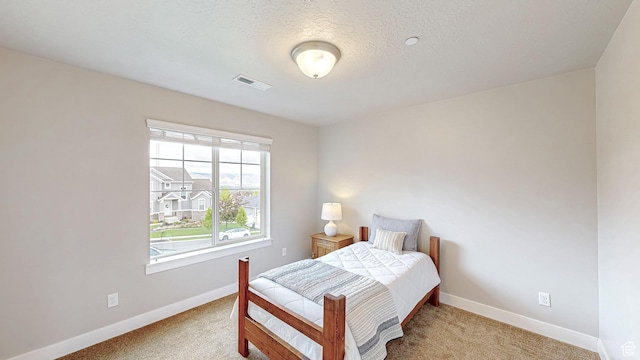 bedroom featuring baseboards and carpet floors