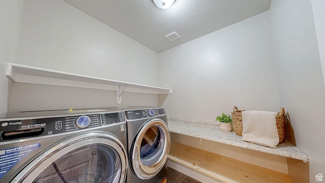 washroom featuring independent washer and dryer