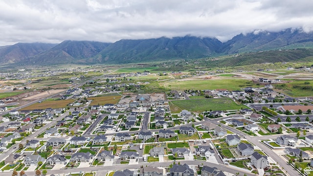 aerial view of property's location with mountains and nearby suburban area