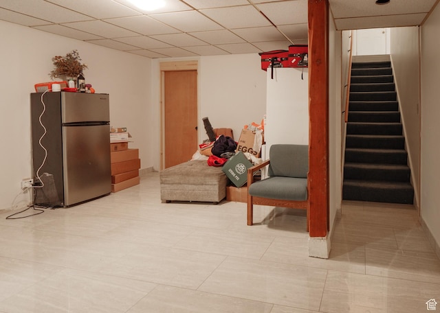 sitting room featuring stairway