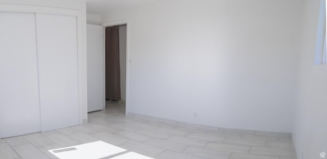 unfurnished bedroom with a closet