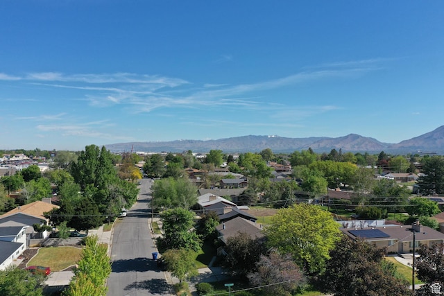aerial view of residential area featuring a mountainous background