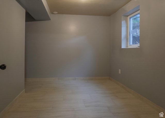 empty room featuring baseboards