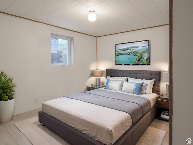 bedroom with ornamental molding