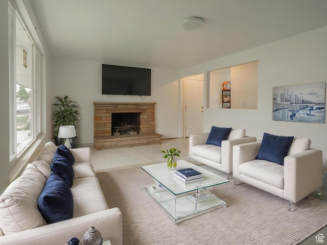 living area featuring a stone fireplace