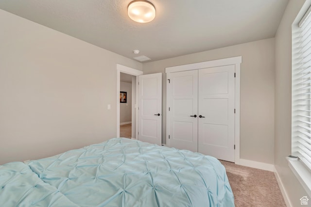 5402 N Meadow Lark Ln, Lehi, UT 84043 - bedroom featuring light carpet, multiple windows, baseboards, and a closet