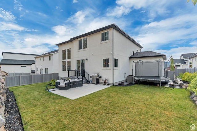 5402 N Meadow Lark Ln, Lehi, UT 84043 - rear view of property featuring a trampoline, a patio, an outdoor living space, stucco siding, and cooling unit