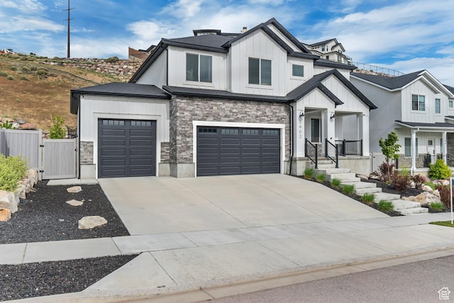 5402 N Meadow Lark Ln, Lehi, UT 84043 - modern farmhouse style home featuring board and batten siding, a gate, stone siding, and driveway
