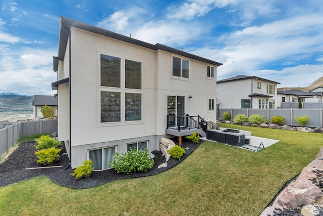 5402 N Meadow Lark Ln, Lehi, UT 84043 - rear view of property with stucco siding and outdoor lounge area