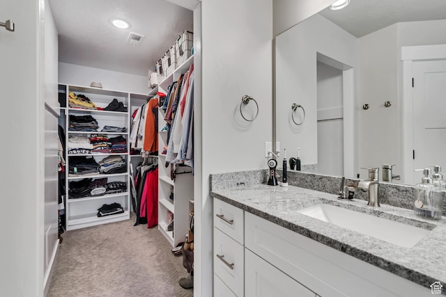 5402 N Meadow Lark Ln, Lehi, UT 84043 - bathroom featuring a walk in closet and vanity