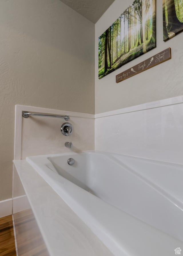 730 S 500 E, Roosevelt, UT 84066 - full bathroom featuring a garden tub, baseboards, and wood finished floors