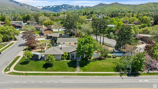 aerial perspective of suburban area featuring a mountain backdrop